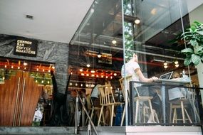 young man working on a laptop in a restaurant