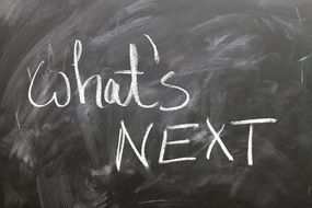 whatâs next, chalk writing on black Board
