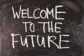 Welcome to the future, blackboard with inscription