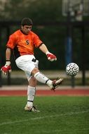 Soccer player with the ball on the field