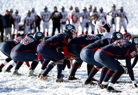 youth American Football Team on snowy field