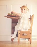 girl at the vintage school desk