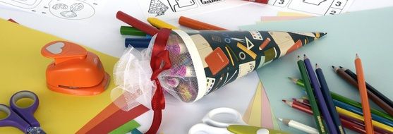 school cone with writing accessories