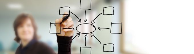 woman drawing graph on the transparent screen