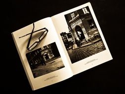 Glasses on open book with photos