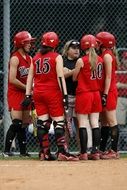 coach with a team in softball