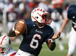 American Football, dark skin man with ball, Quarterback