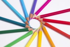 multi-colored pencil in a circle