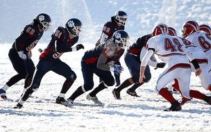 American Football Game on snowy field