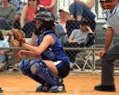 Girl is playing softball on the competition