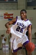 young dark skin Basketball Player in Game
