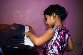 Cute child Girl Playing Piano