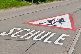 the inscription on the road near the school