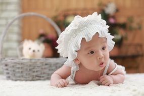 cute baby in the white hat