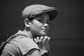 black and white photo of a boy with a pensive face