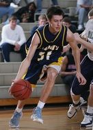 basketball player dribbling a ball