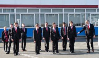 young men in red ties