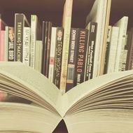 open book on a shelf in the library