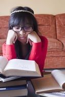 Asian girl studying school books