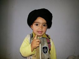 cute asian child boy pointing up