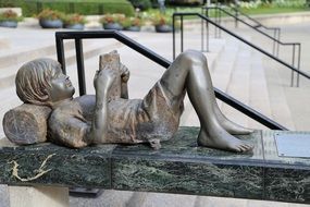 Girl Reading stone statue