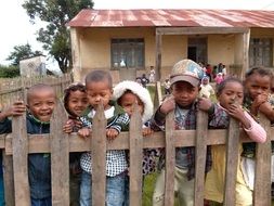 Children at fence in School yard, madagascar