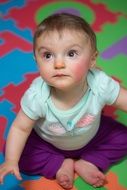 portrait of a kid on a colorful rug