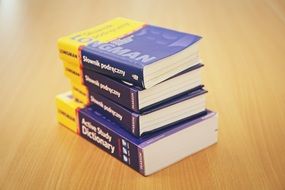 stack of educational books on the table