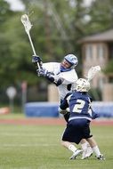 players play lacrosse on the field
