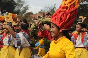 happy high school students in bright costumes