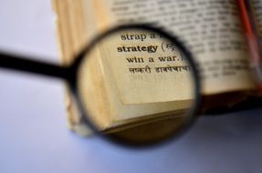 Dictionary under a magnifying glass