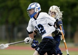 players with a stick in lacrosse