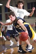 young Basketball Players with ball in Game