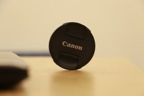 cover from the Canon camera on the table