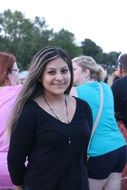 smiling pretty girl with Lutheran cross on neck