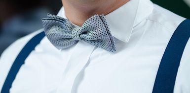 bow tie on groom's neck close up