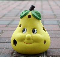 ceramic pear with funny face