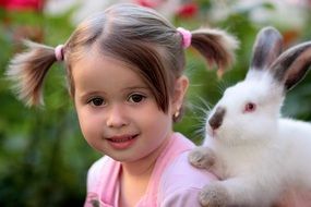 cute girl with a white rabbit