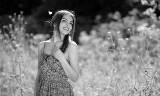 girl in the field black and white portrait