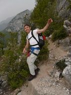 happy climber man on the mountain