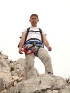 climber stands on a cliff