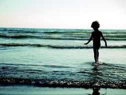 child on sandy surf