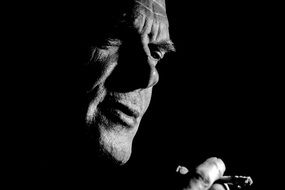 black and white portrait of a smoking man