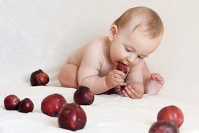 little baby and red apples