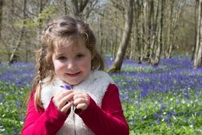 girl on the wild field of bluebells