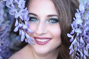 portrait of a beautiful girl among flowers