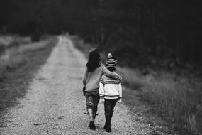 black and white photo of children on the road