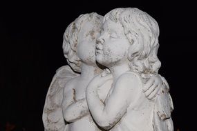 statue of white romantic angels