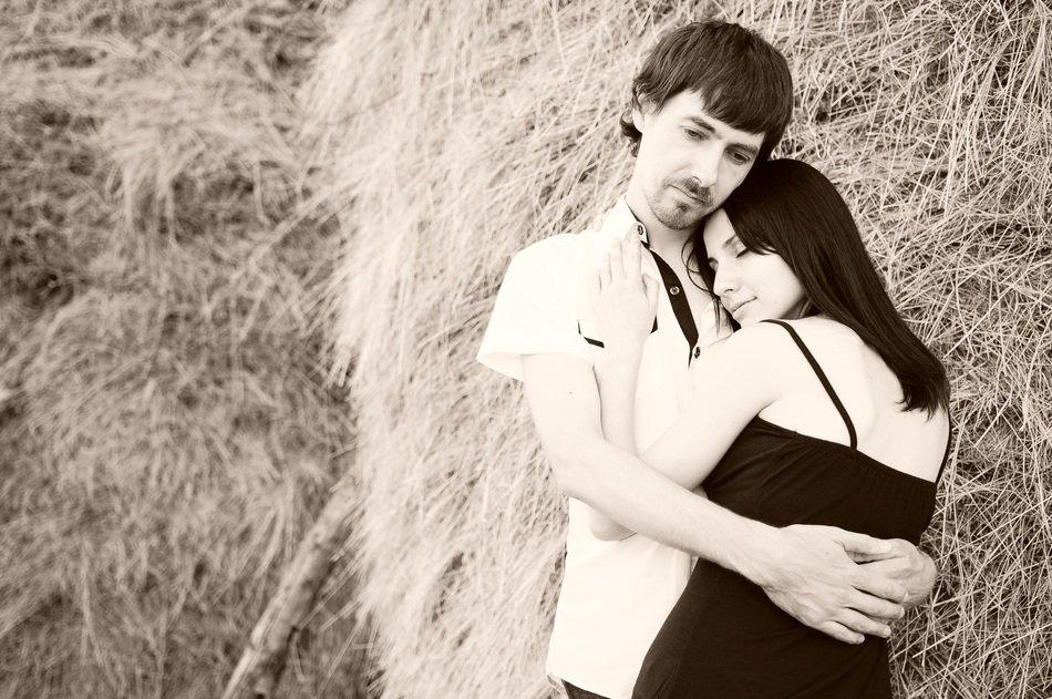 happy couple on the straw background