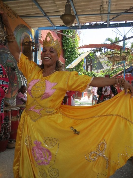 dancing woman in a yellow suit